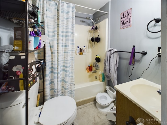 full bathroom featuring vanity, shower / bath combo, and toilet