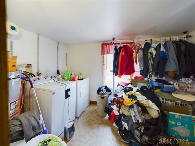 washroom featuring light colored carpet and washing machine and dryer