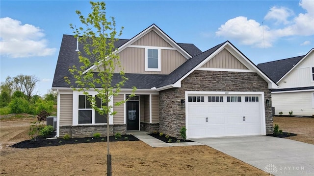 1507 Kingsgate, Springfield, OH 45502 - craftsman inspired home with stone siding, board and batten siding, concrete driveway, a garage, and a shingled roof