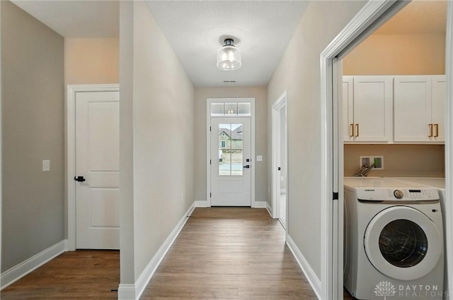 1507 Kingsgate, Springfield, OH 45502 - laundry area with washer / clothes dryer, cabinet space, wood finished floors, and baseboards