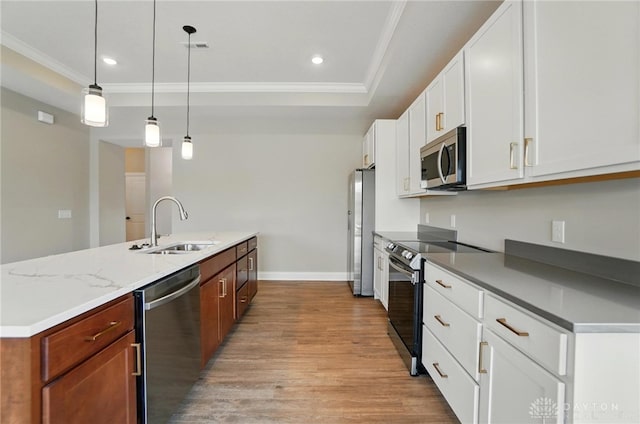 1507 Kingsgate, Springfield, OH 45502 - kitchen featuring stainless steel appliances, a sink, ornamental molding, light wood finished floors, and baseboards