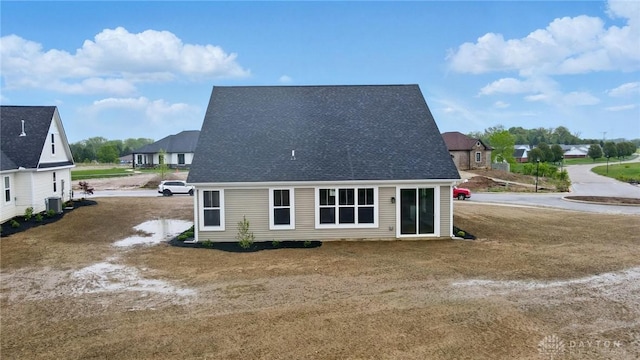 1507 Kingsgate, Springfield, OH 45502 - back of property with central AC and roof with shingles