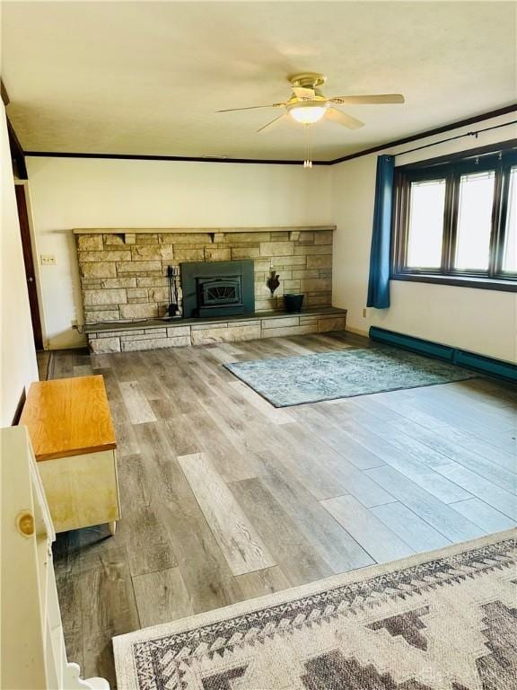 unfurnished living room featuring ornamental molding, hardwood / wood-style floors, and ceiling fan