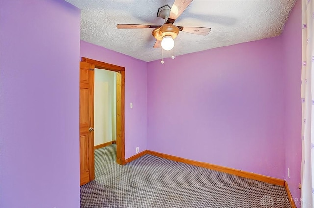 unfurnished room with ceiling fan, a textured ceiling, and carpet flooring