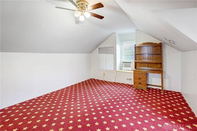 bonus room with vaulted ceiling, carpet floors, cooling unit, and ceiling fan