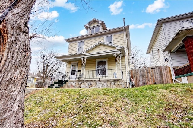 view of front facade with a porch and a front yard