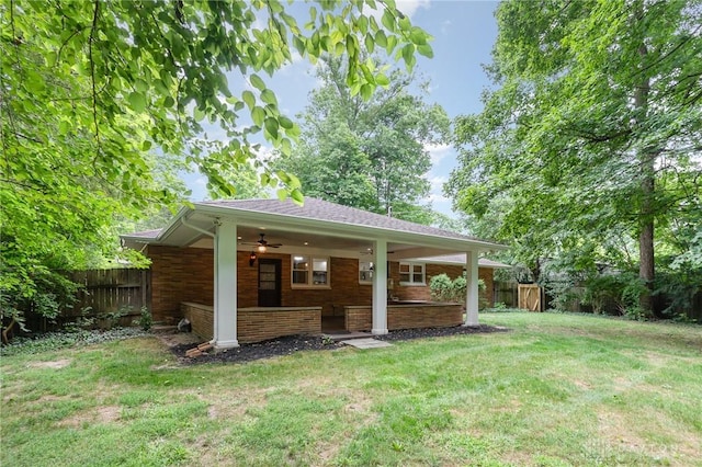 view of yard featuring ceiling fan