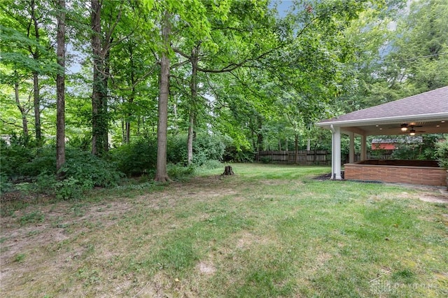 view of yard featuring ceiling fan