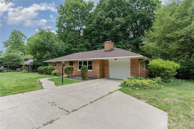 single story home featuring a garage and a front lawn