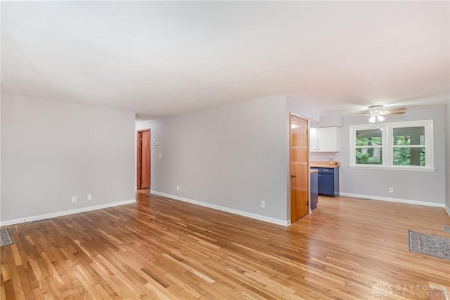 unfurnished living room featuring ceiling fan and light hardwood / wood-style floors