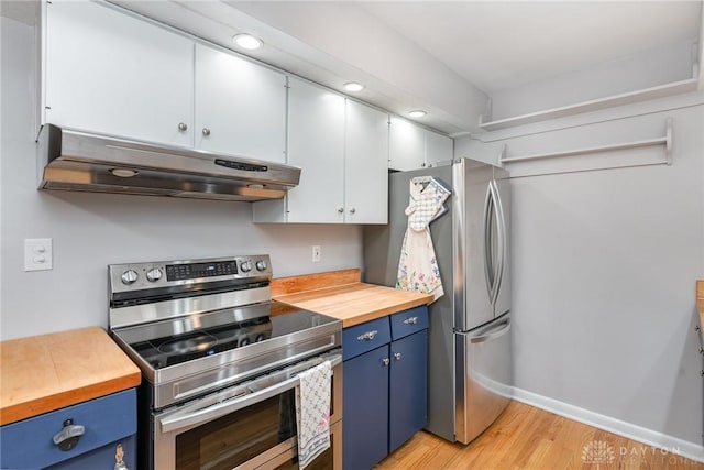 kitchen featuring light hardwood / wood-style flooring, blue cabinetry, appliances with stainless steel finishes, white cabinetry, and wood counters