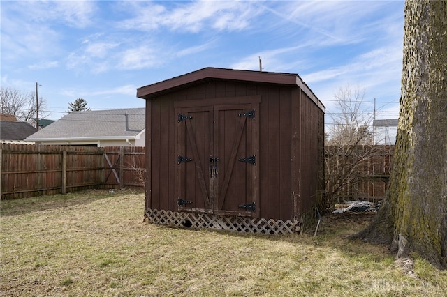 view of outbuilding featuring a lawn