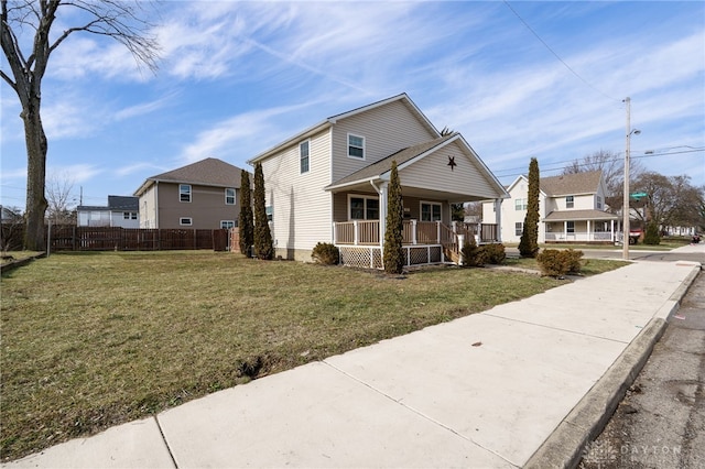 view of front of house with a front lawn and a porch