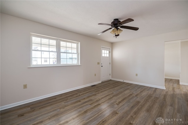 entrance foyer with dark wood-type flooring and ceiling fan