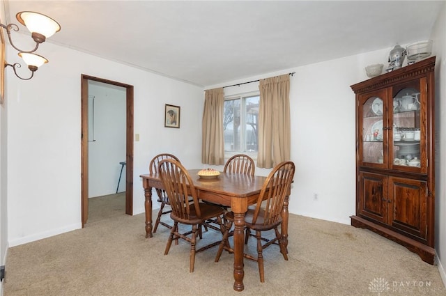 dining space with light colored carpet