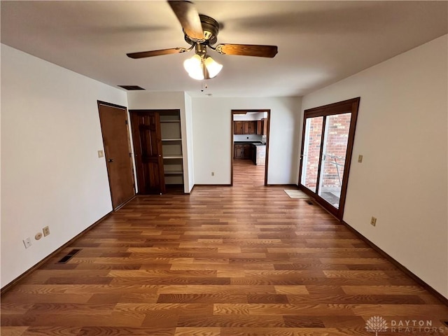 unfurnished bedroom with hardwood / wood-style flooring, ceiling fan, and access to outside