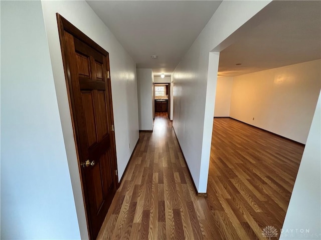 corridor featuring dark wood-type flooring