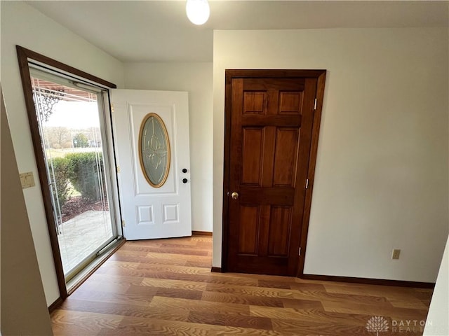 entryway with light hardwood / wood-style floors