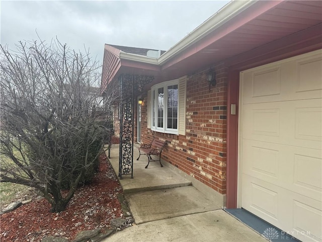 view of exterior entry featuring a garage