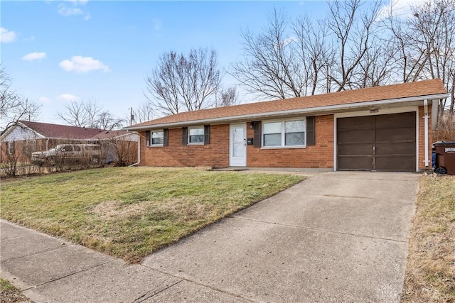 single story home featuring a garage and a front lawn