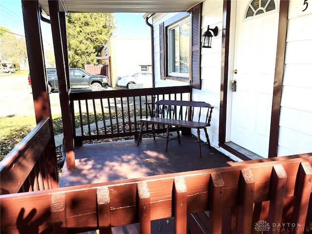 wooden terrace with a porch