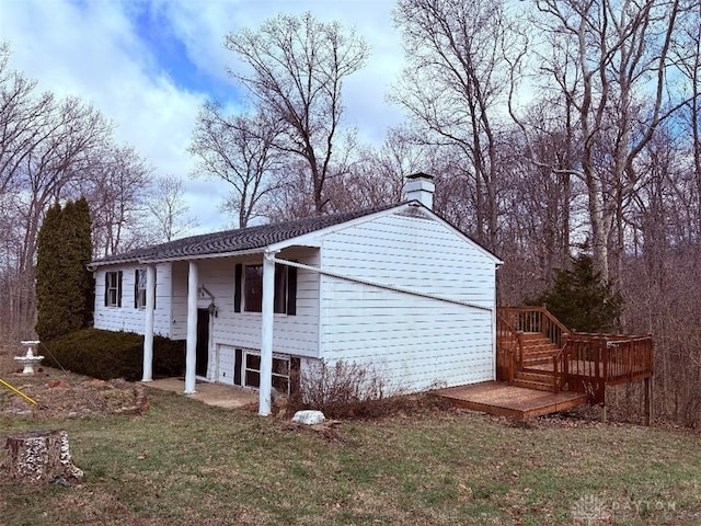 view of property exterior with a lawn