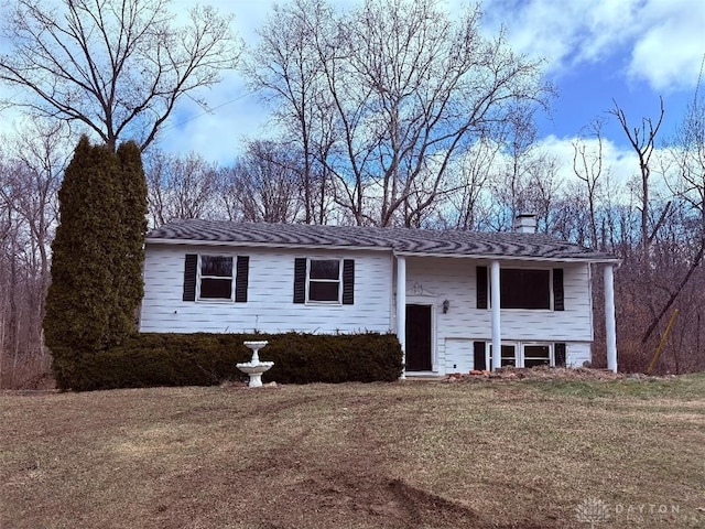 split foyer home with a front lawn