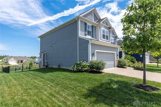 view of side of property with a garage and a yard