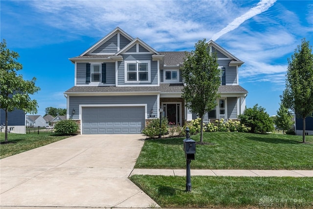 craftsman inspired home featuring a garage and a front yard