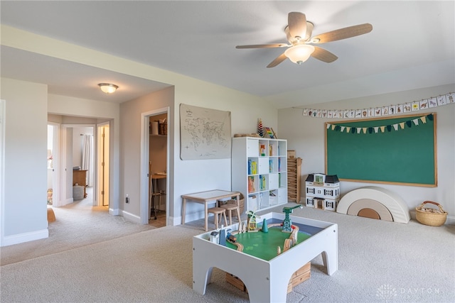 game room featuring light carpet and ceiling fan