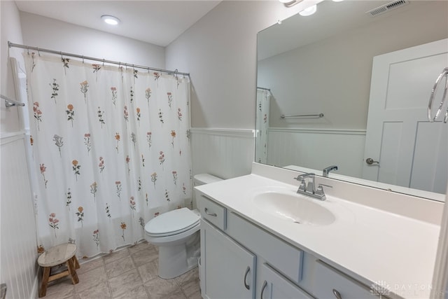 full bathroom featuring vanity, toilet, and shower / bath combo with shower curtain