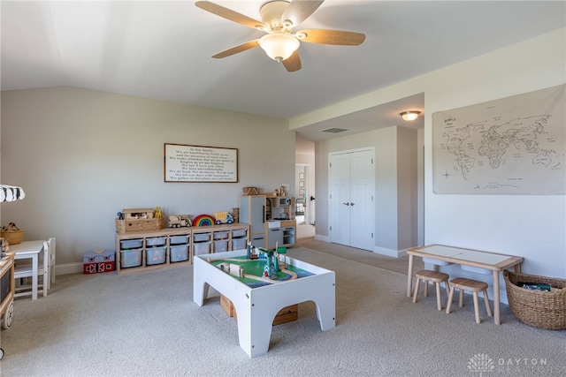 game room featuring ceiling fan, lofted ceiling, and carpet flooring