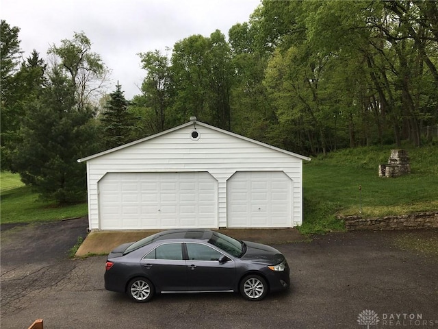 garage with a yard