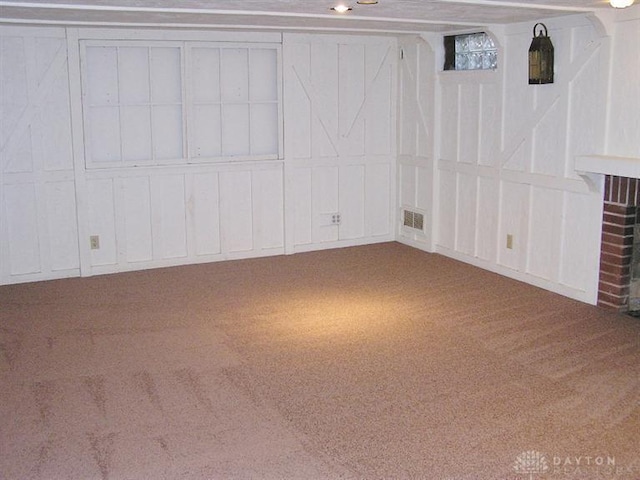 basement featuring carpet flooring