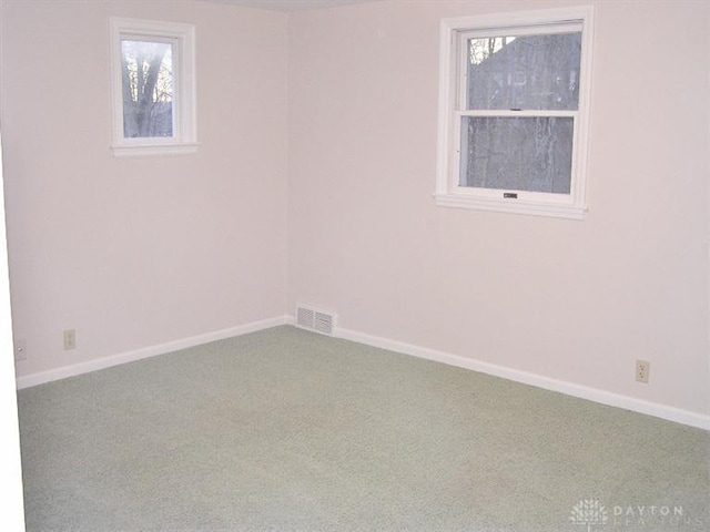 spare room with carpet floors