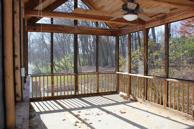 unfurnished sunroom featuring vaulted ceiling and ceiling fan