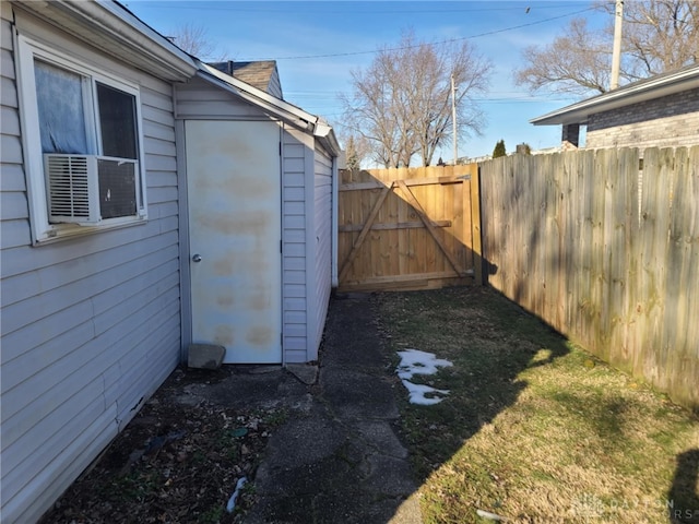 view of yard with cooling unit, a gate, and fence