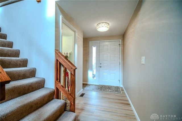 foyer with light hardwood / wood-style flooring