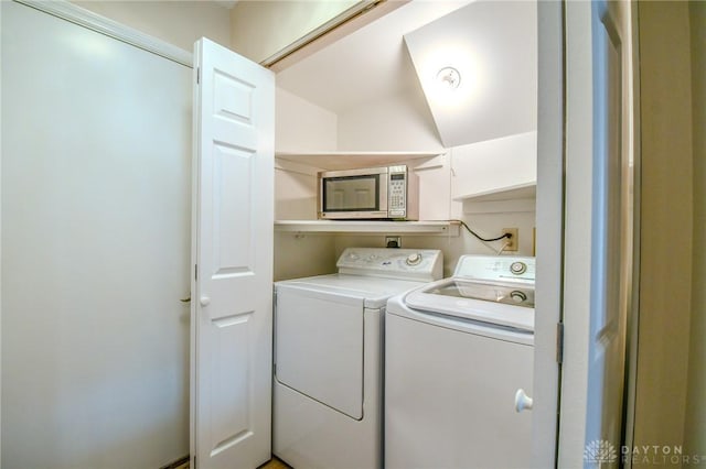 clothes washing area with independent washer and dryer