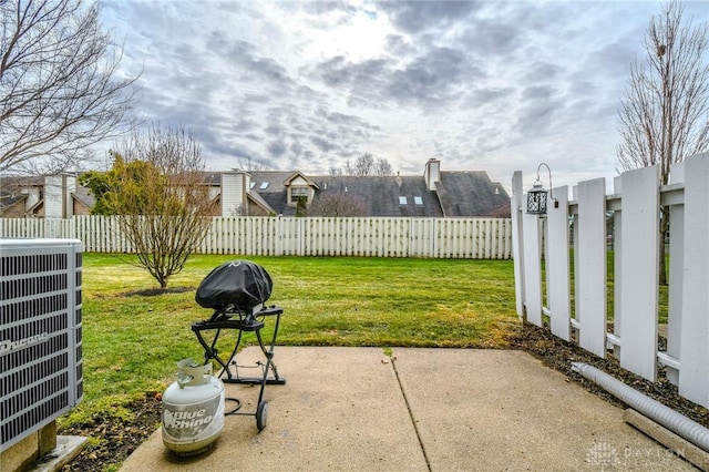 view of yard with cooling unit and a patio area