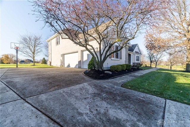 view of home's exterior with a yard and a garage