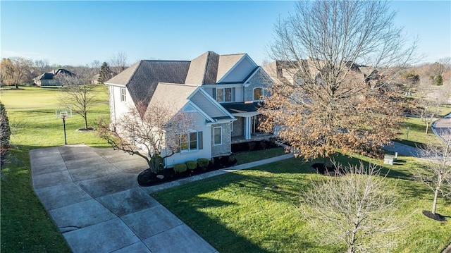 view of side of property with a yard