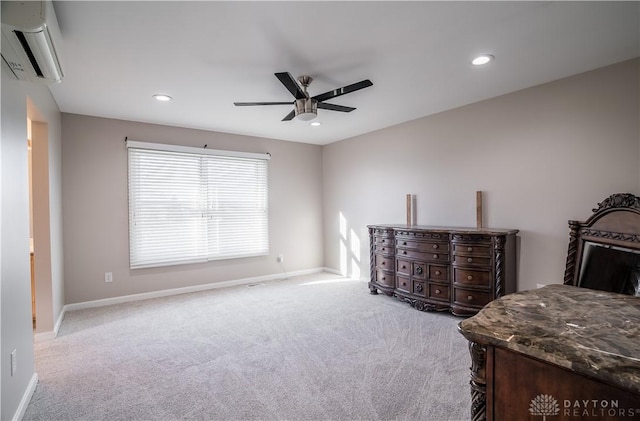 carpeted bedroom featuring a wall mounted air conditioner and ceiling fan