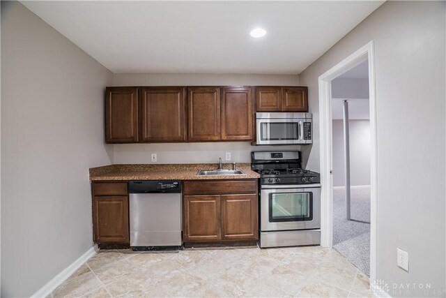 kitchen with appliances with stainless steel finishes and sink