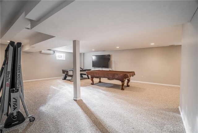 recreation room featuring pool table, a wall mounted air conditioner, and light colored carpet