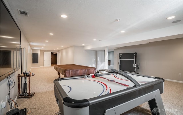 recreation room with pool table, light colored carpet, and a textured ceiling