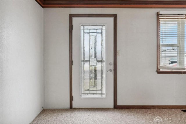 entryway with a healthy amount of sunlight and carpet