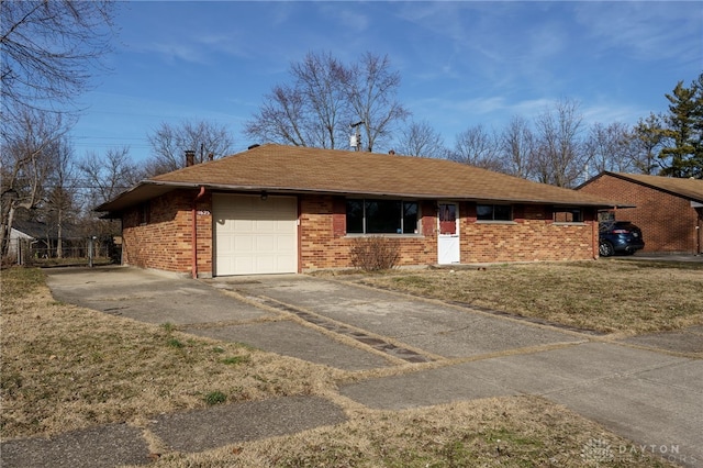 single story home featuring a garage and a front yard