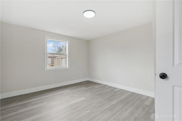 spare room featuring light wood-type flooring