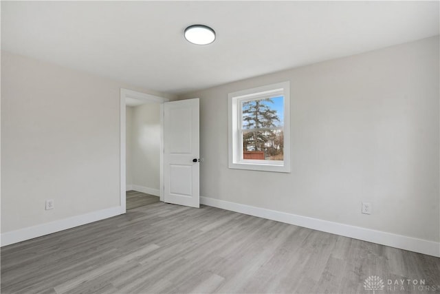 spare room with light hardwood / wood-style flooring